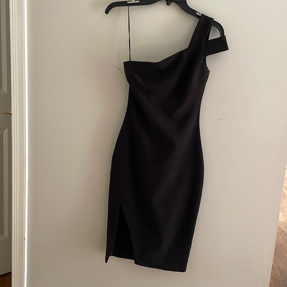Likely one shoulder mid length black dress